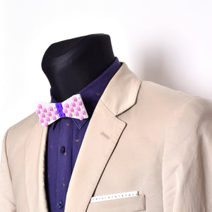 White with purple center and pink dots