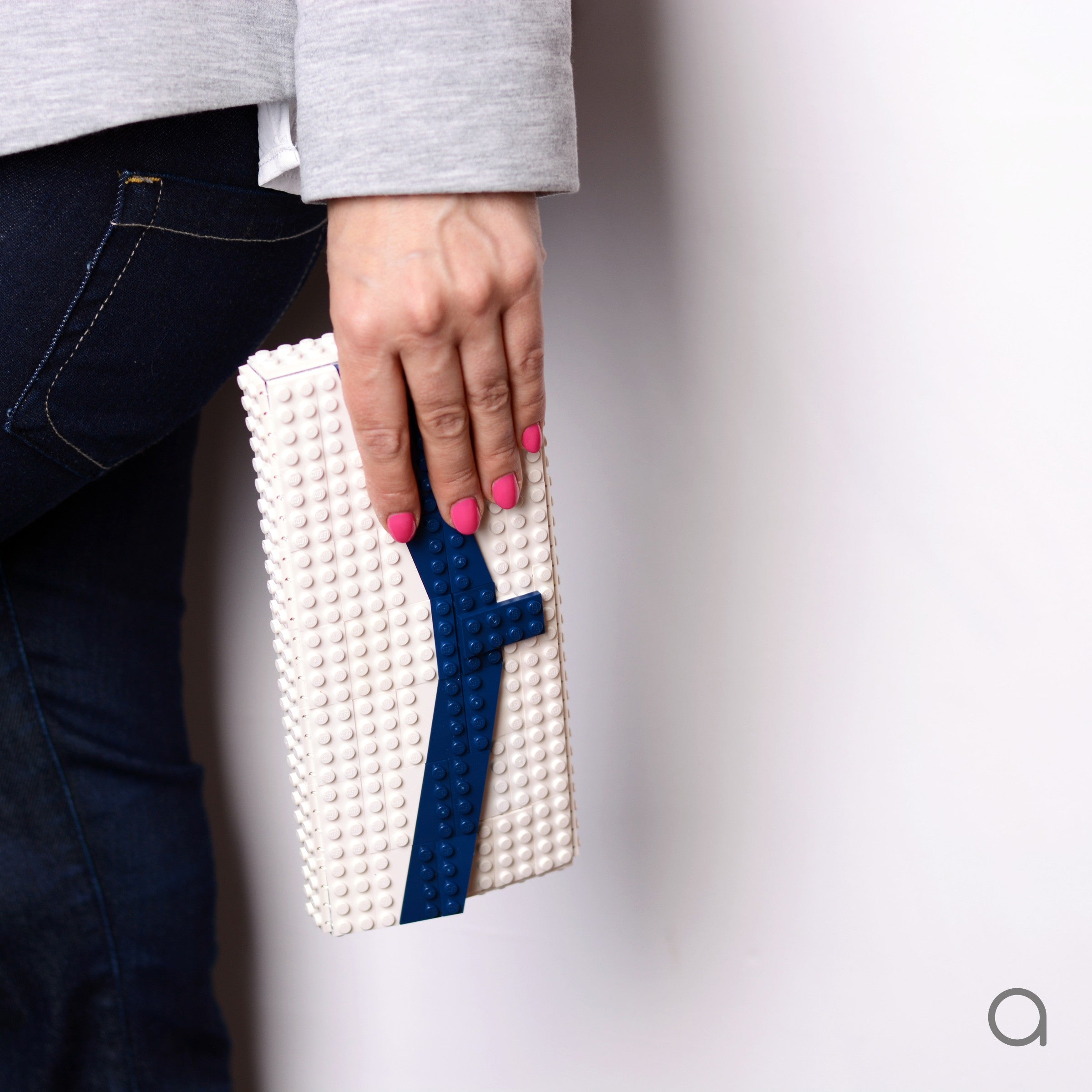 White clutch with dark blue chevron